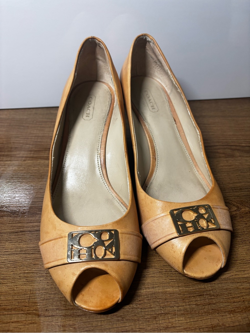 Coach Women's Tan Peep-Toe Flats with Gold Logo Plaque